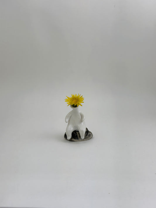 Tiny Vase Person Sitting on a Rock