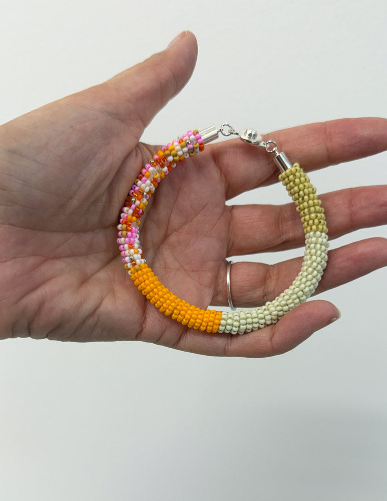 Bead rope bracelet - green, yellow, bead soup